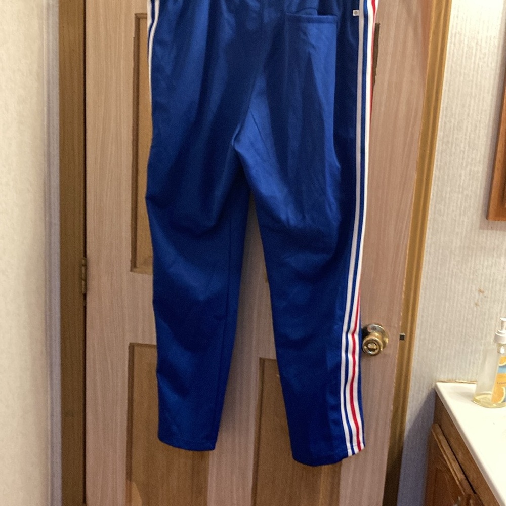 Men’s Adidas jogging pants. Royal blue. Red, white and blue stripes.
